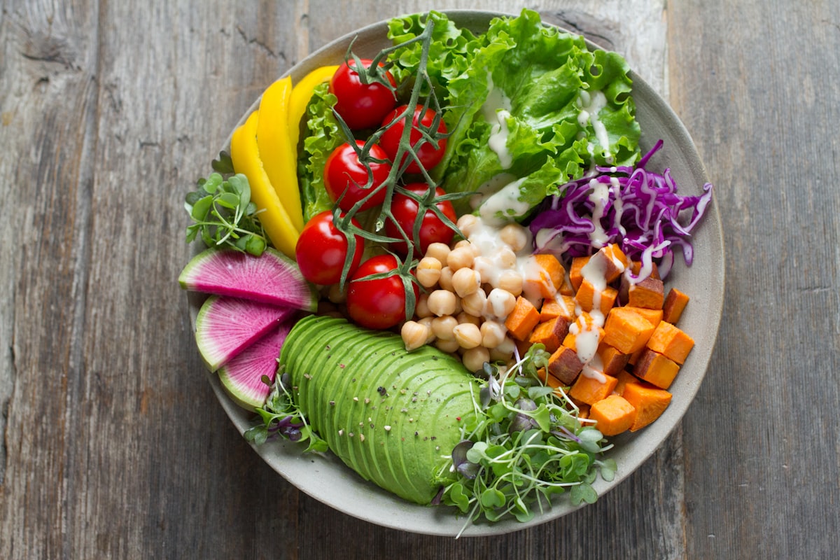Person preparing healthy meals with fresh ingredients